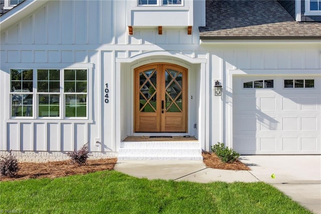 view of exterior entry with a garage