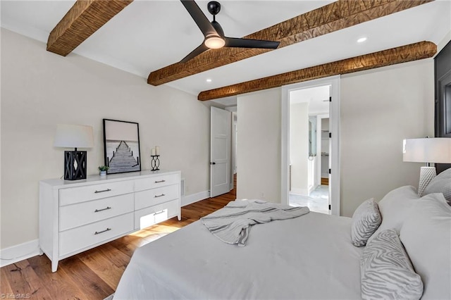 bedroom with ceiling fan, light hardwood / wood-style flooring, and beamed ceiling