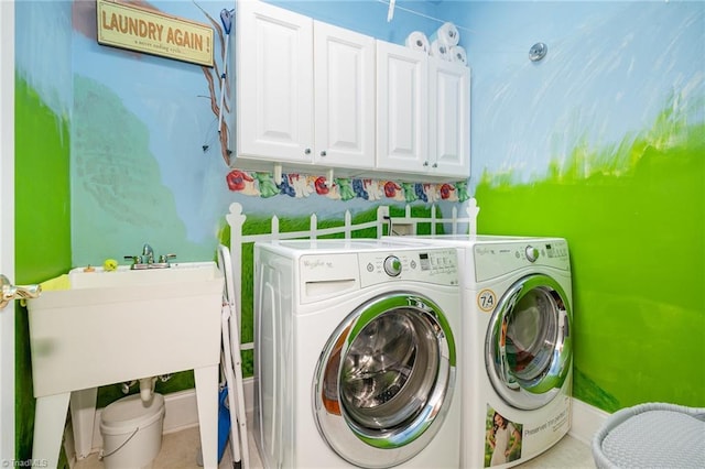 221 Oakmont Park Ct, Kernersville, NC 27284 - laundry area featuring cabinet space, washing machine and clothes dryer, and baseboards