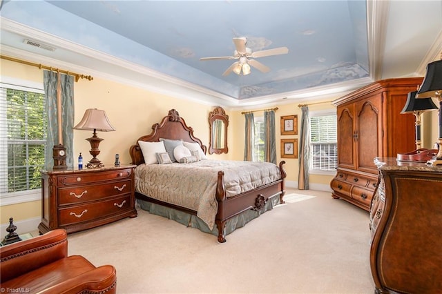 221 Oakmont Park Ct, Kernersville, NC 27284 - bedroom featuring a raised ceiling, light carpet, multiple windows, baseboards, and ornamental molding