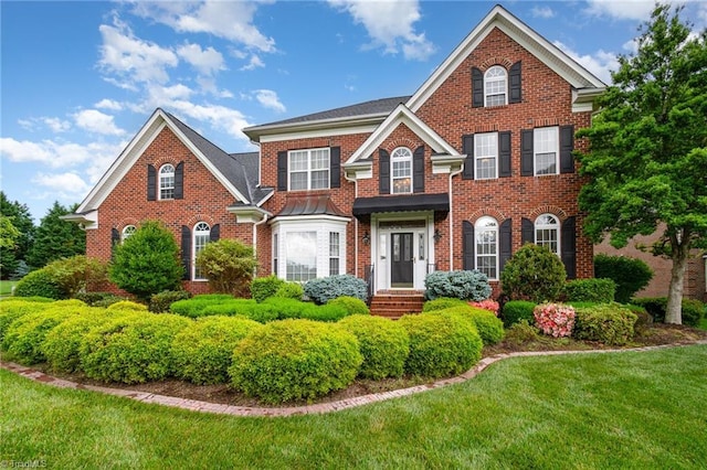 221 Oakmont Park Ct, Kernersville, NC 27284 - colonial inspired home featuring brick siding and a front yard