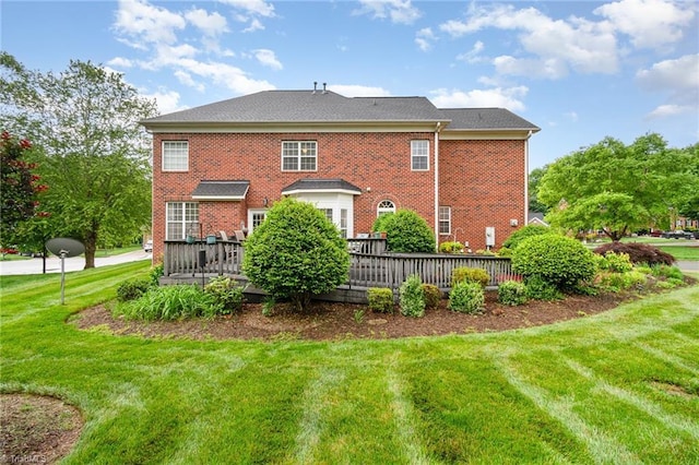 221 Oakmont Park Ct, Kernersville, NC 27284 - back of property featuring a yard, brick siding, and a wooden deck