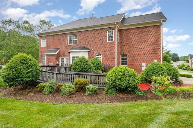 221 Oakmont Park Ct, Kernersville, NC 27284 - back of house featuring a wooden deck, a lawn, and brick siding
