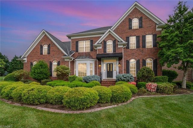 221 Oakmont Park Ct, Kernersville, NC 27284 - georgian-style home featuring brick siding and a front yard
