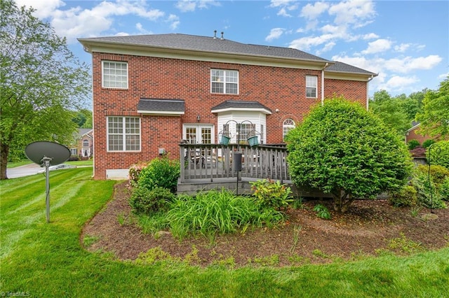 221 Oakmont Park Ct, Kernersville, NC 27284 - rear view of house featuring a lawn, brick siding, and a wooden deck