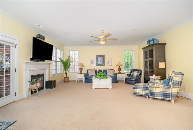 221 Oakmont Park Ct, Kernersville, NC 27284 - living room featuring carpet, crown molding, ceiling fan, healthy amount of natural light, and a fireplace with flush hearth