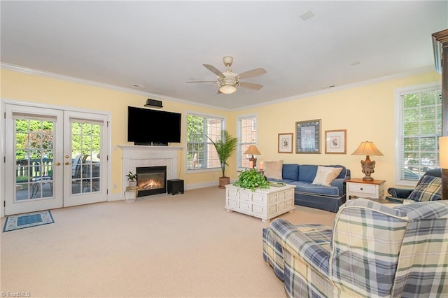 221 Oakmont Park Ct, Kernersville, NC 27284 - living room featuring healthy amount of natural light, a ceiling fan, ornamental molding, french doors, and light carpet