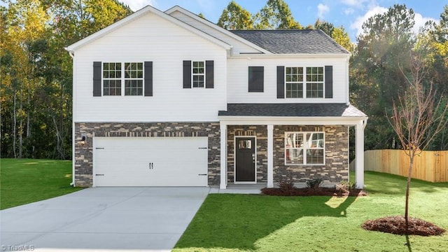 view of front facade with a garage and a front yard