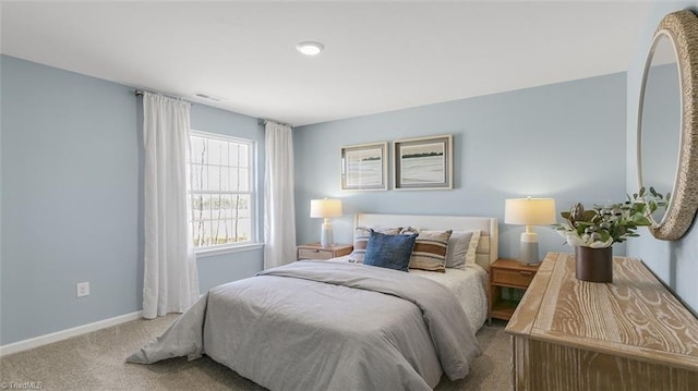 bedroom featuring light carpet