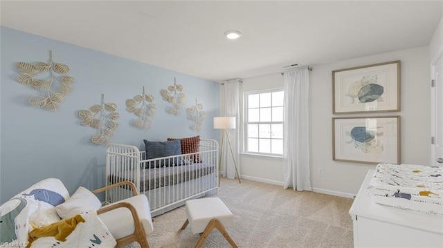 bedroom featuring light colored carpet
