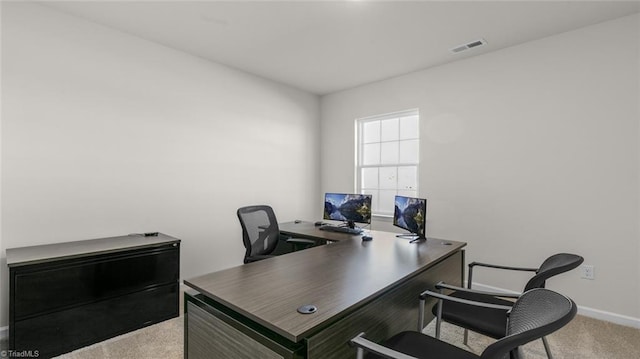 home office with light colored carpet