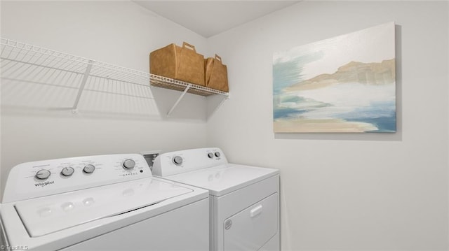 laundry room with washing machine and clothes dryer