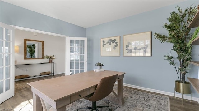 office with hardwood / wood-style flooring and french doors