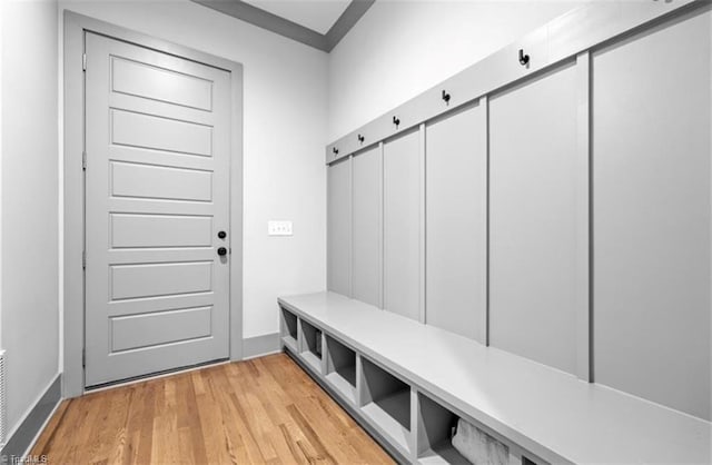 mudroom with light hardwood / wood-style floors