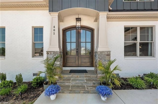 entrance to property featuring french doors