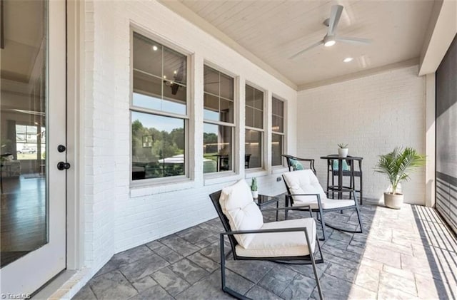 view of patio featuring ceiling fan