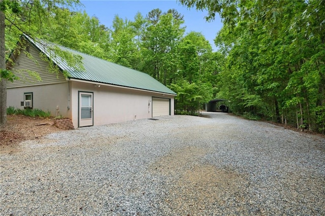 garage featuring driveway