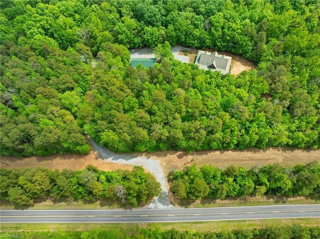 drone / aerial view with a view of trees