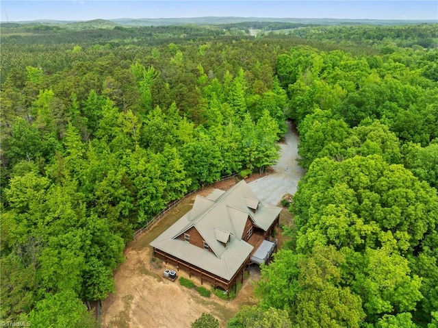 aerial view featuring a wooded view