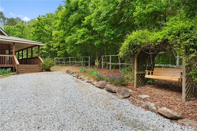 view of yard featuring a wooden deck