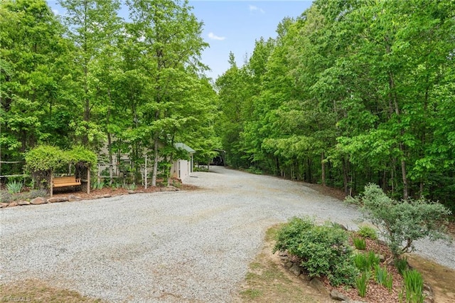 view of road featuring a wooded view