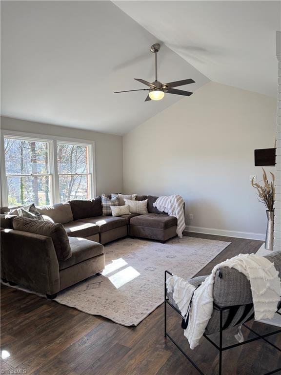 living room featuring vaulted ceiling, ceiling fan, and dark hardwood / wood-style flooring