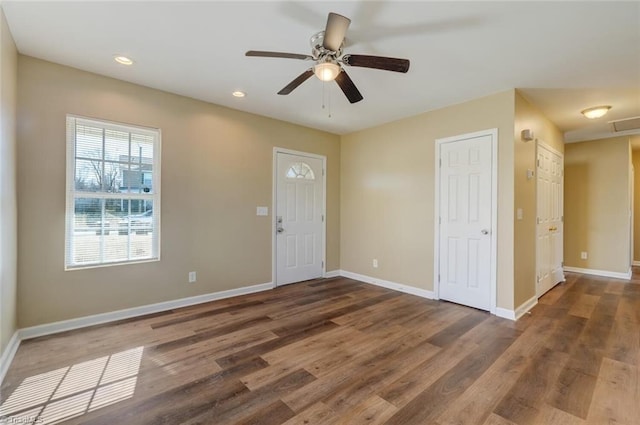 entrance foyer with ceiling fan and dark hardwood / wood-style flooring