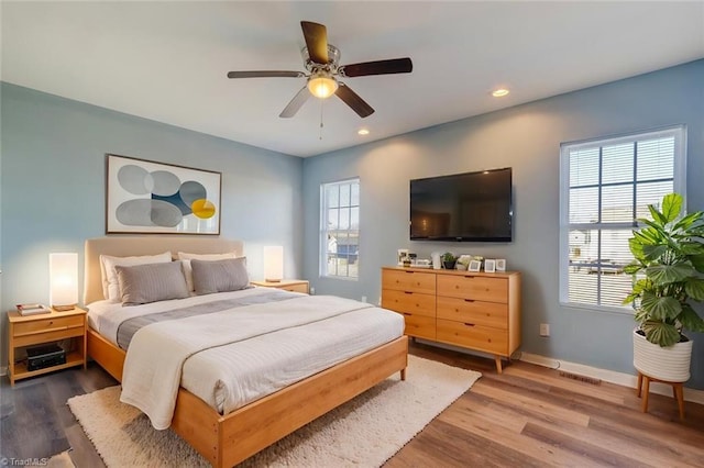 bedroom featuring ceiling fan and hardwood / wood-style floors