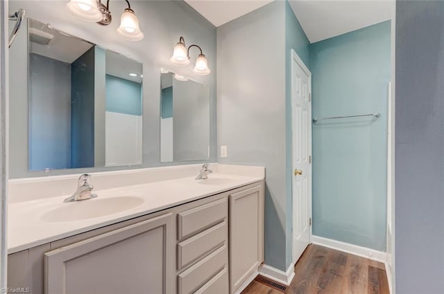 bathroom featuring vanity and hardwood / wood-style flooring