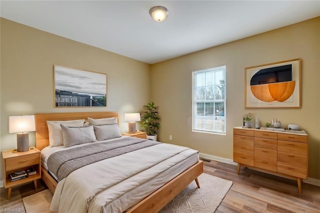 bedroom with light wood-type flooring