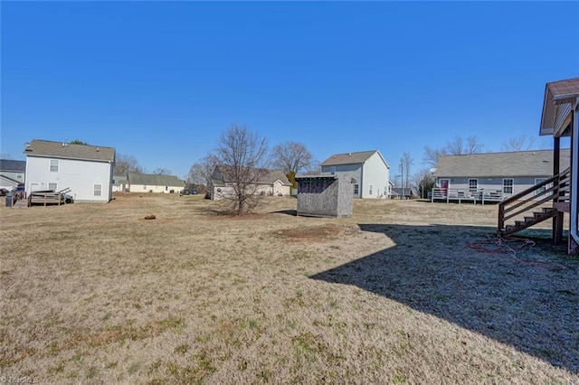 view of yard featuring a storage shed