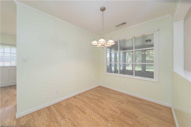 640 Summerest Ct, Kernersville, NC 27284 - spare room featuring a chandelier, wood finished floors, crown molding, and a textured ceiling