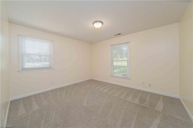 640 Summerest Ct, Kernersville, NC 27284 - spare room with carpet and a textured ceiling