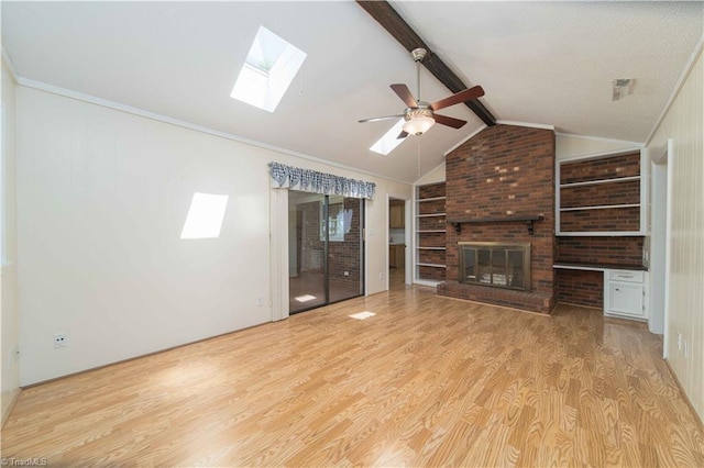 640 Summerest Ct, Kernersville, NC 27284 - unfurnished living room featuring a skylight, wood finished floors, a ceiling fan, and a brick fireplace