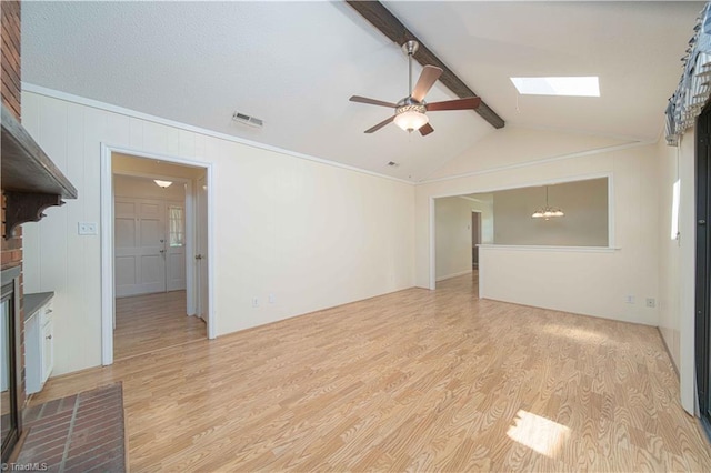 640 Summerest Ct, Kernersville, NC 27284 - unfurnished living room featuring a skylight, light wood finished floors, a ceiling fan, and a chandelier