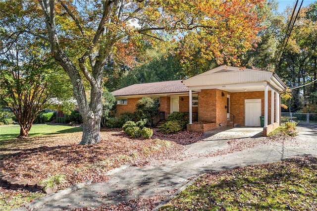 ranch-style home featuring a carport