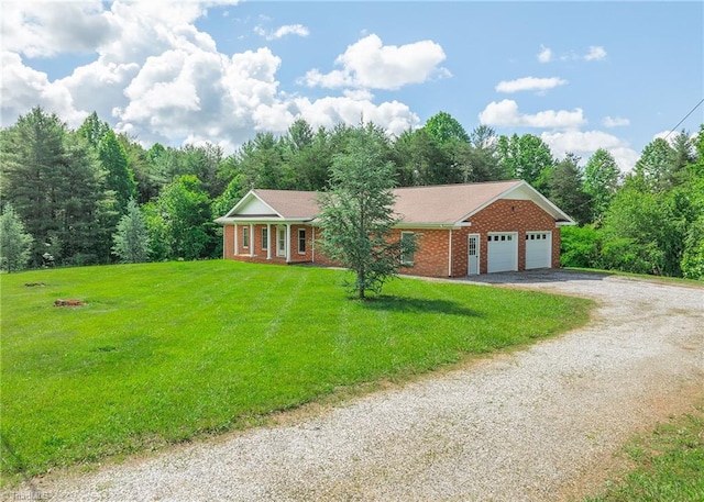 ranch-style house with a garage and a front lawn