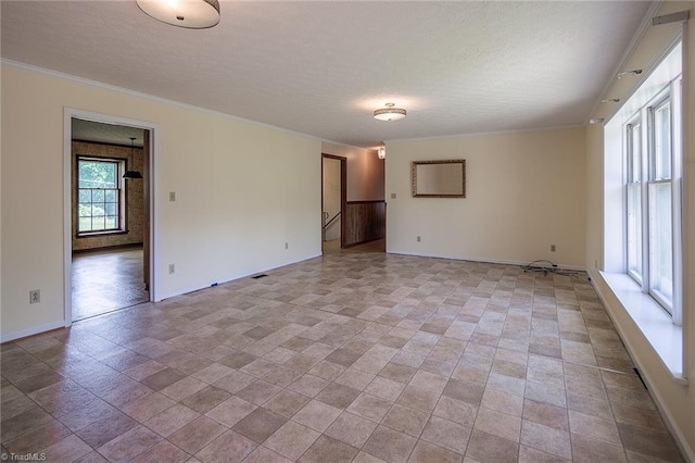 spare room featuring ornamental molding