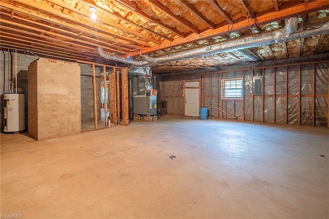 basement featuring electric panel, gas water heater, and heating unit