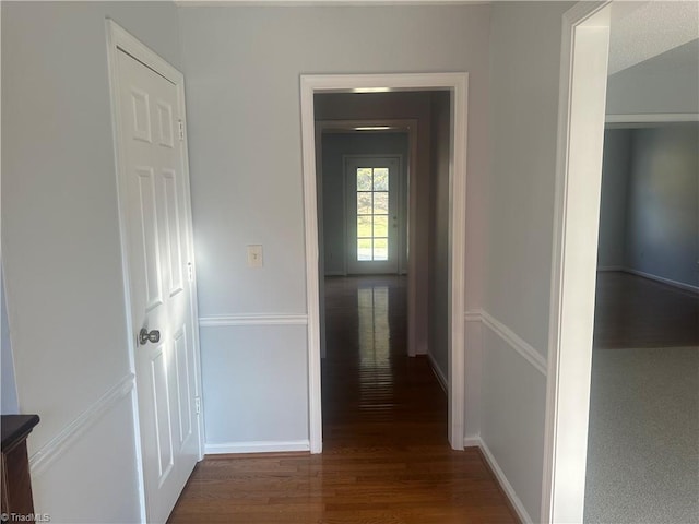 hallway featuring dark hardwood / wood-style floors