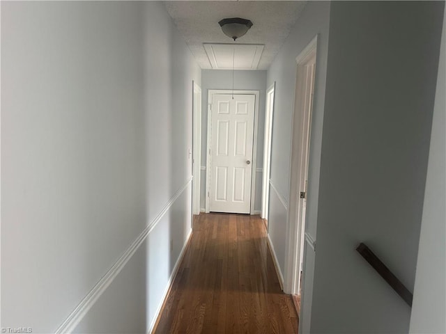 hallway with dark hardwood / wood-style floors