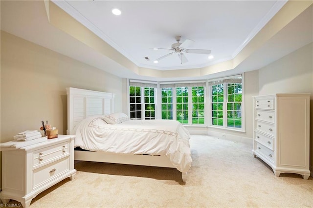 bedroom with ornamental molding, a raised ceiling, recessed lighting, light colored carpet, and ceiling fan