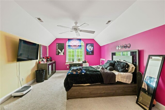 carpeted bedroom featuring lofted ceiling, ceiling fan, and baseboards