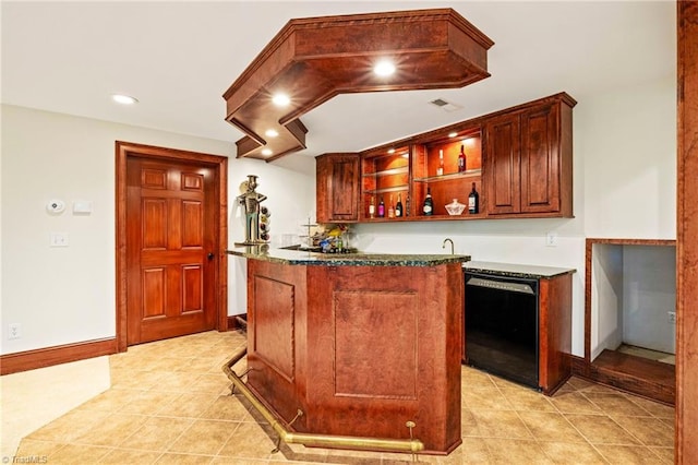 indoor wet bar featuring black dishwasher, light tile patterned floors, baseboards, and recessed lighting