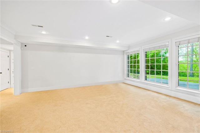 unfurnished room featuring light carpet, recessed lighting, crown molding, and baseboards