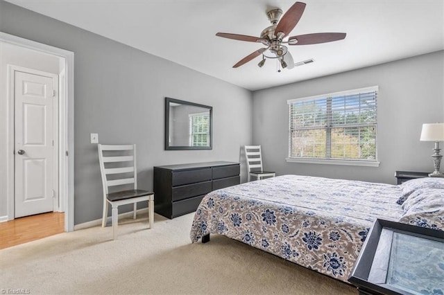 carpeted bedroom featuring ceiling fan