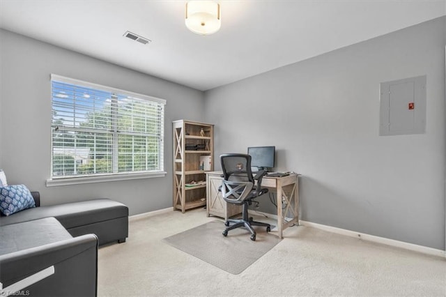 carpeted home office with electric panel