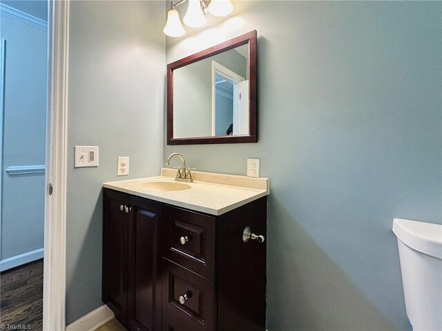 2025 Pope Rd, Winston-Salem, NC 27127 - half bath featuring vanity, toilet, baseboards, and a chandelier