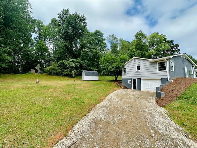 2025 Pope Rd, Winston-Salem, NC 27127 - view of green lawn with dirt driveway, an attached garage, and view of wooded area