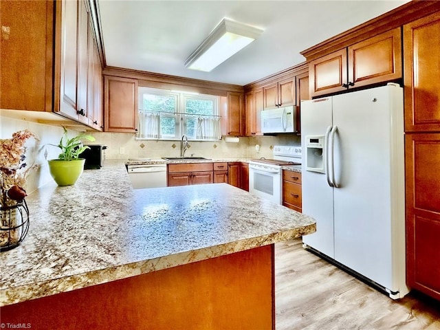 2025 Pope Rd, Winston-Salem, NC 27127 - kitchen with white appliances, a sink, light countertops, tasteful backsplash, and light wood-style floors